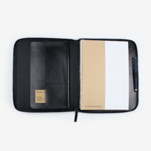 Open black A4 leather compendium with internal pockets and pen loop.